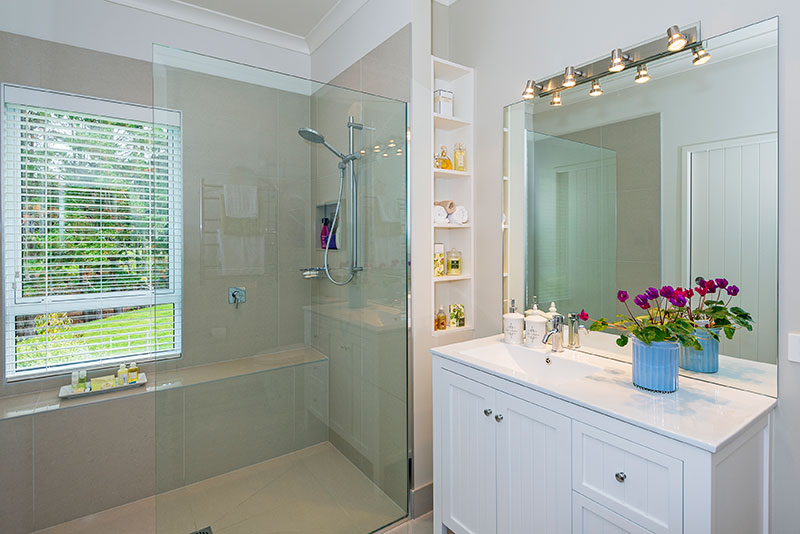 Traditional and modern style bathroom in colonial style award winning home built by Precision Homes