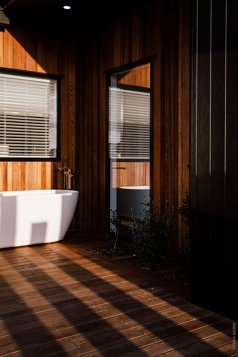 sun streaming in on gorgeous outdoor bath on deck