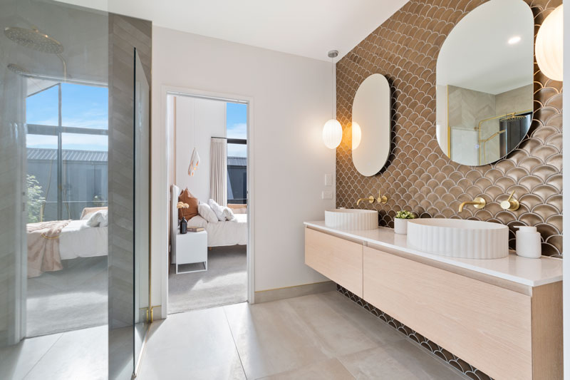 Gorgeous ensuite bathroom with double basin, copper fishscale mosaic, Newtech timber Vanity, Paerata Rise showhome