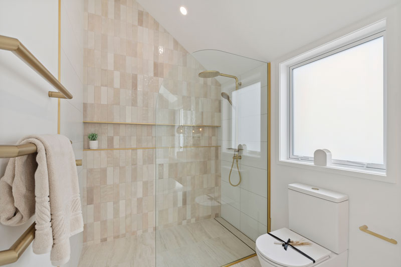 Gorgeous mediterranean/morrocan inspired bathroom with fluted timber vanity, terracotta Mr Ralph lights, Precision Homes showhome