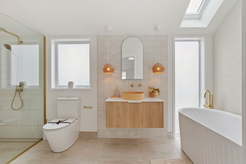 Gorgeous mediterranean/morrocan inspired bathroom with fluted timber vanity, terracotta Mr Ralph lights, Precision Homes showhome