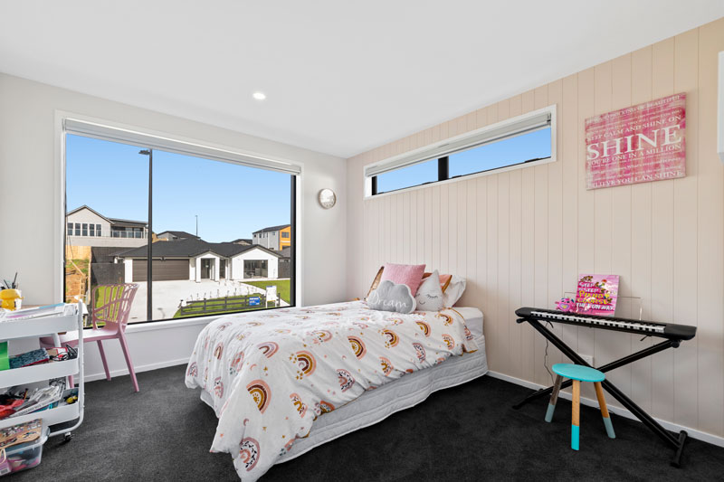 childs bedroom with pink James Hardie feature wall