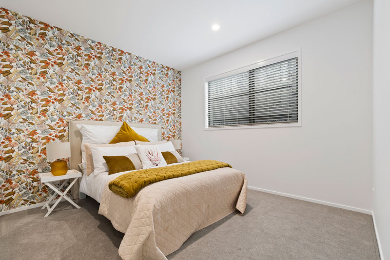Beautiful guest bed with feature wall in our new showhome in Paerata Rise