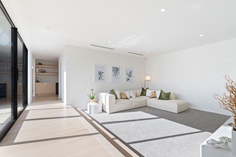 Large spacious, sun-drenched, sunken lounge in our new showhome in Paerata Rise