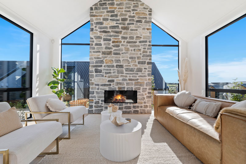 Stunning schist fireplace and open plan living space in our new showhome in Paerata Rise