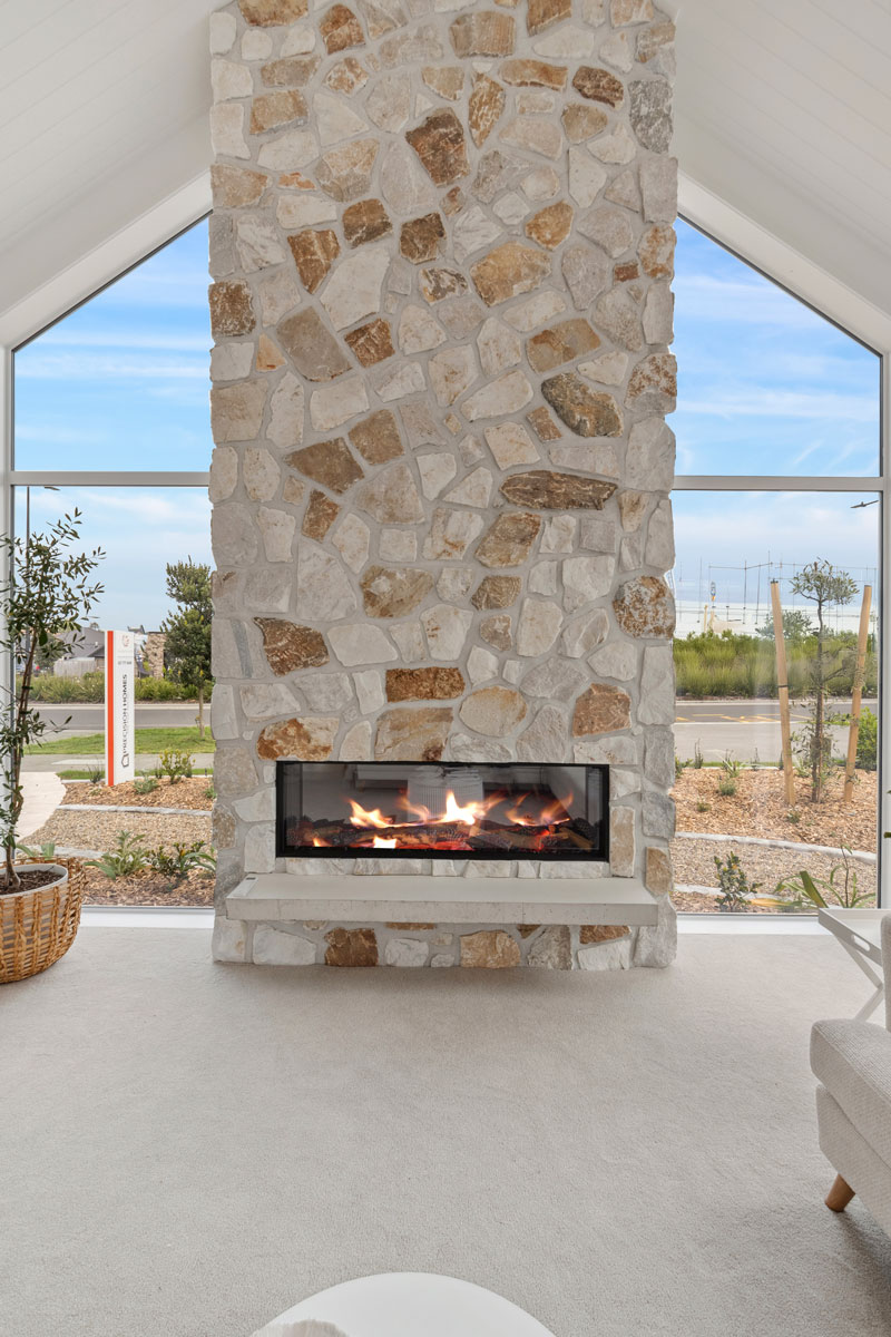 Gorgeous Med inspired home,Sumner Schist Irregular Stone Vintage white fireplace, angled windows, Precision homes showhome