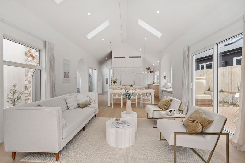 Gorgeous Med inspired home vaulted ceilings, light white interior Velux Skylights, Precision homes showhome