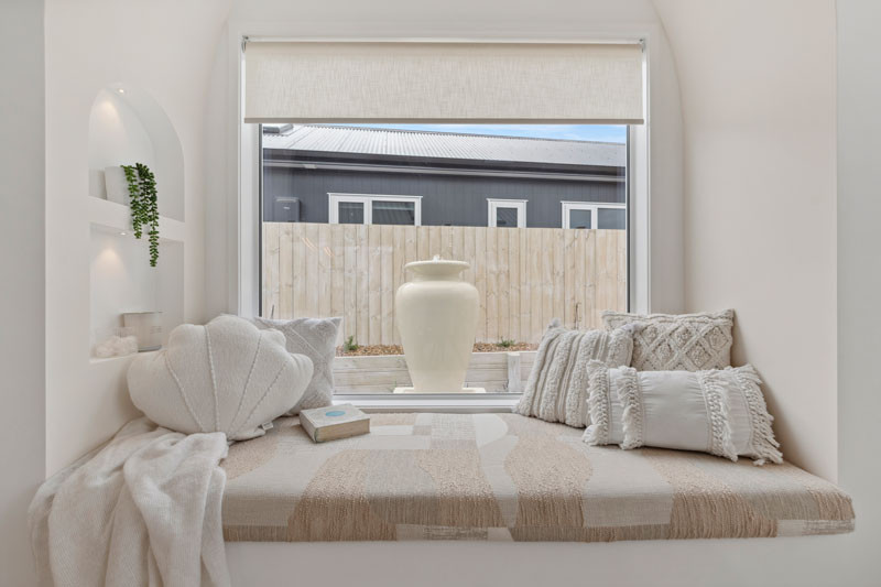 Gorgeous Med inspired home window seat with arched niche boxes, water feature outside, Precision homes showhome