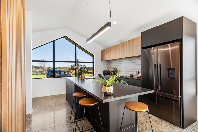 Gorgeous light timber and black kitchen in award winning home in Franklin