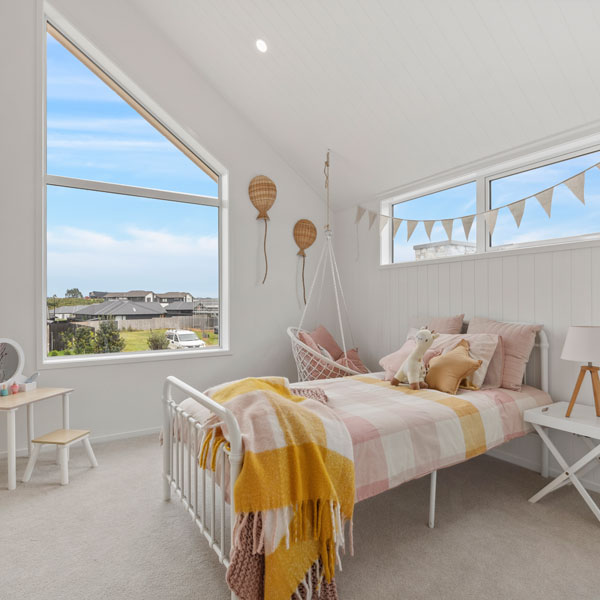 Precision Homes Showhome girls bedroom, angled ceiling and window, hardigroove paneling