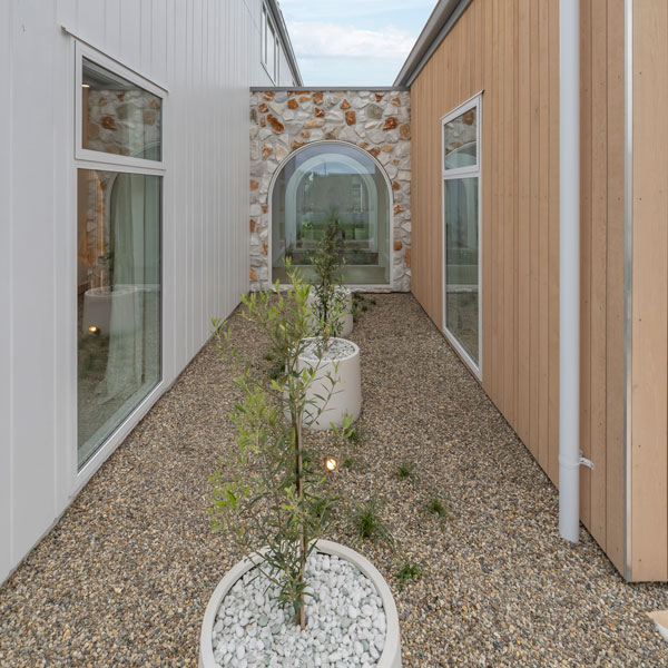 38 Te Rata Boulevard back garden, irregular stone wall, arched window